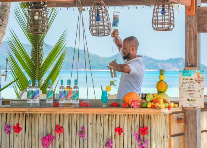 Have cocktails and tapas at Cafe des Arts on the island of Praslin